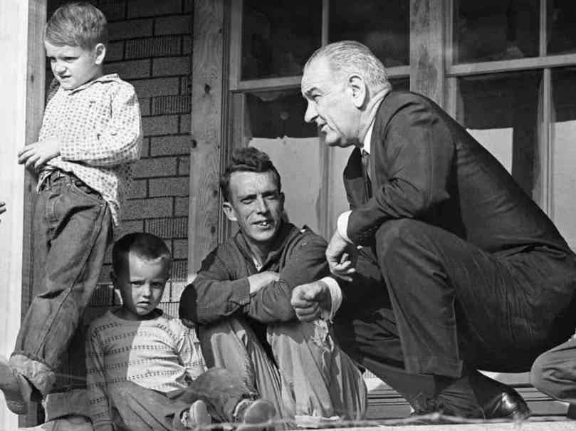 LBJ with the Fletcher family of Inez, KY.